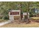 House exterior with a tree-lined yard at 5035 Fairforest Dr, Stone Mountain, GA 30088