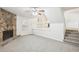 Spacious living room with a stone fireplace and neutral carpeting at 5035 Fairforest Dr, Stone Mountain, GA 30088