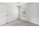 Bright bedroom with neutral walls and carpet at 5035 Fairforest Dr, Stone Mountain, GA 30088