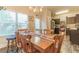 Dining area with wooden table and chairs, kitchen partially visible at 7162 Fringe Flower Dr # 21, Austell, GA 30168