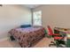 Simple bedroom with a full bed, desk, and window at 7162 Fringe Flower Dr # 21, Austell, GA 30168