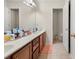 Double vanity bathroom with a large mirror and plenty of storage at 204 Somerton Pl, Cumming, GA 30040