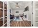 View of living room with hardwood floors, fireplace, and access to sunroom at 204 Somerton Pl, Cumming, GA 30040