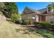 Landscaped backyard with patio and ample green space at 204 Somerton Pl, Cumming, GA 30040
