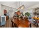 Open concept dining room with a view into the kitchen area at 204 Somerton Pl, Cumming, GA 30040