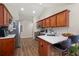 Kitchen with light wood cabinets, white countertops, and stainless steel appliances at 204 Somerton Pl, Cumming, GA 30040