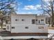 Rear view of a modern two-story house with light beige siding at 464 Glendale Rd, Scottdale, GA 30079