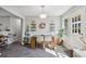 Dining area with wooden table and access to backyard at 9695 Broad Leaf Ct, Villa Rica, GA 30180