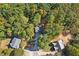 Aerial view of a residential neighborhood surrounded by trees at 9695 Broad Leaf Ct, Villa Rica, GA 30180