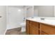 Bathroom with a tub, toilet and wood vanity at 124 Silver Fox Trl, Dallas, GA 30157