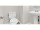 Clean bathroom with pedestal sink and toilet at 124 Silver Fox Trl, Dallas, GA 30157
