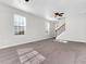 Large living room with neutral walls, carpet, and ceiling fan at 124 Silver Fox Trl, Dallas, GA 30157