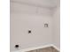 Clean laundry room with built-in shelving and hookups at 124 Silver Fox Trl, Dallas, GA 30157