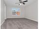 Spacious bedroom featuring a ceiling fan and large window at 124 Silver Fox Trl, Dallas, GA 30157