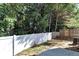 Private backyard with white vinyl fence at 124 Silver Fox Trl, Dallas, GA 30157
