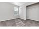 Bright bedroom with neutral carpeting and closet at 124 Silver Fox Trl, Dallas, GA 30157