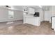 Modern kitchen with white cabinets, black appliances, and tile floor at 124 Silver Fox Trl, Dallas, GA 30157
