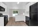 Kitchen with black appliances and white cabinets at 124 Silver Fox Trl, Dallas, GA 30157