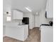 Modern kitchen with white cabinets and black appliances at 124 Silver Fox Trl, Dallas, GA 30157