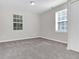 Well-lit bedroom with two windows and closet at 124 Silver Fox Trl, Dallas, GA 30157