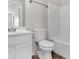 Clean bathroom with white vanity and tub at 124 Silver Fox Trl, Dallas, GA 30157