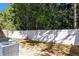 Backyard view of home with AC unit and fence at 124 Silver Fox Trl, Dallas, GA 30157