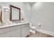 Elegant powder room featuring a gray vanity and wood floors at 187 Fontaine Sw Rd, Mableton, GA 30126