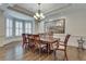 Formal dining room with hardwood floors, crown molding, and a large chandelier at 187 Fontaine Sw Rd, Mableton, GA 30126
