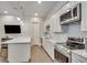 Basement kitchen with stainless steel appliances and white cabinets at 187 Fontaine Sw Rd, Mableton, GA 30126