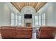 Gathering room with vaulted ceiling, stone fireplace, and large windows at 187 Fontaine Sw Rd, Mableton, GA 30126