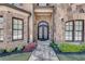 Ornate double doors at the entrance of a house with stone exterior at 187 Fontaine Sw Rd, Mableton, GA 30126