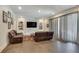 Basement game room with leather couches and built-in shelves at 187 Fontaine Sw Rd, Mableton, GA 30126