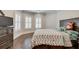 Bright bedroom featuring hardwood floors and a king-size bed at 187 Fontaine Sw Rd, Mableton, GA 30126