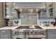 Modern kitchen with stainless steel range and custom backsplash at 187 Fontaine Sw Rd, Mableton, GA 30126