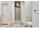Bathroom with a walk-in shower and herringbone tile floor at 187 Fontaine Sw Rd, Mableton, GA 30126