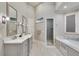 Bathroom with double vanity, marble countertops, and a large shower at 187 Fontaine Sw Rd, Mableton, GA 30126