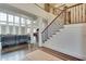 Open staircase in two-story foyer, offering a spacious and bright feel at 187 Fontaine Sw Rd, Mableton, GA 30126