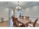 Formal dining room features hardwood floors, tray ceiling and chandelier at 187 Fontaine Sw Rd, Mableton, GA 30126