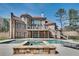 Luxury pool and spa adjacent to the home's exterior at 187 Fontaine Sw Rd, Mableton, GA 30126