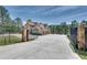 Automatic gate opens to a large home with a three-car garage at 187 Fontaine Sw Rd, Mableton, GA 30126