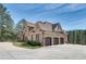 Three-car garage with brick and stone exterior at 187 Fontaine Sw Rd, Mableton, GA 30126