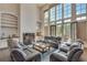 Spacious living room with high ceilings, fireplace, and large windows at 187 Fontaine Sw Rd, Mableton, GA 30126