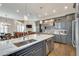 Open kitchen with a large island and custom cabinetry at 187 Fontaine Sw Rd, Mableton, GA 30126