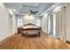 Main bedroom with hardwood floors, high ceilings, and access to a private balcony at 187 Fontaine Sw Rd, Mableton, GA 30126