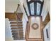 Grand staircase with dark hardwood treads and an intricate inlaid floor design at 187 Fontaine Sw Rd, Mableton, GA 30126