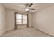 Spacious bedroom with ceiling fan and neutral carpeting at 4569 Grenadine Cir, Acworth, GA 30101