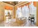 Large bathroom with marble flooring, bathtub, and large windows at 2288 Peachtree Nw Rd # 6, Atlanta, GA 30305