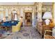 Spacious living area with ornate moldings and a view into another room at 2288 Peachtree Nw Rd # 6, Atlanta, GA 30305