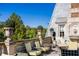 Elegant rooftop terrace with stone balustrade, comfortable seating, and lush landscaping at 2288 Peachtree Nw Rd # 6, Atlanta, GA 30305