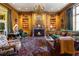 Spacious library with wood paneling, built-in bookshelves, and a fireplace at 2288 Peachtree Nw Rd # 6, Atlanta, GA 30305